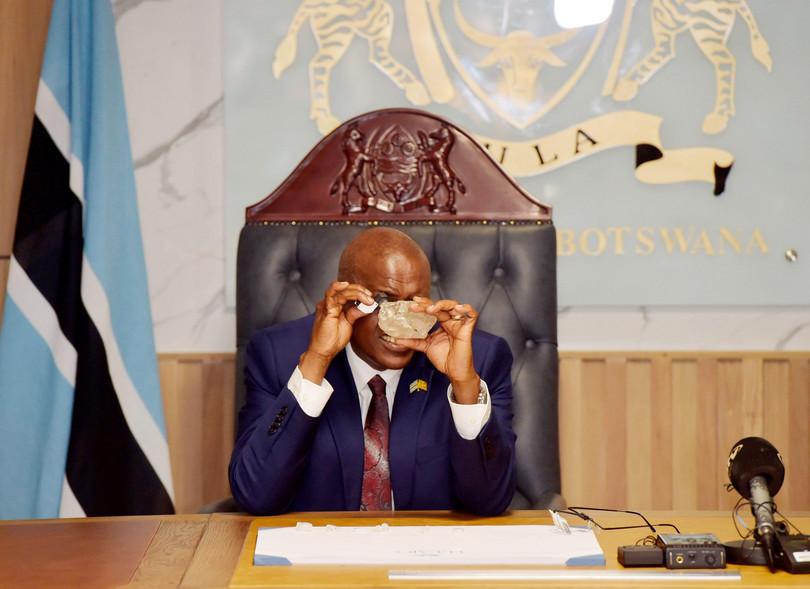 Botswanan President Mokgweetsi Masisi inspects the 2,492-carat diamond discovered in the Karowe Diamond Mine in north-central Botswana, in Gaborone, Botswana, on Aug. 22, 2024.
