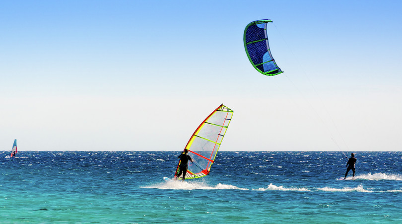 Decorative image of two windsurfers.