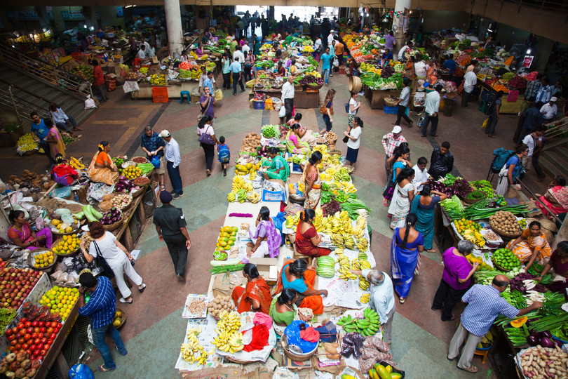 People buying vegetables from a vegetable market, Municipal Market, Panaji, North Goa, India: Exotica/Alamy Stock photo